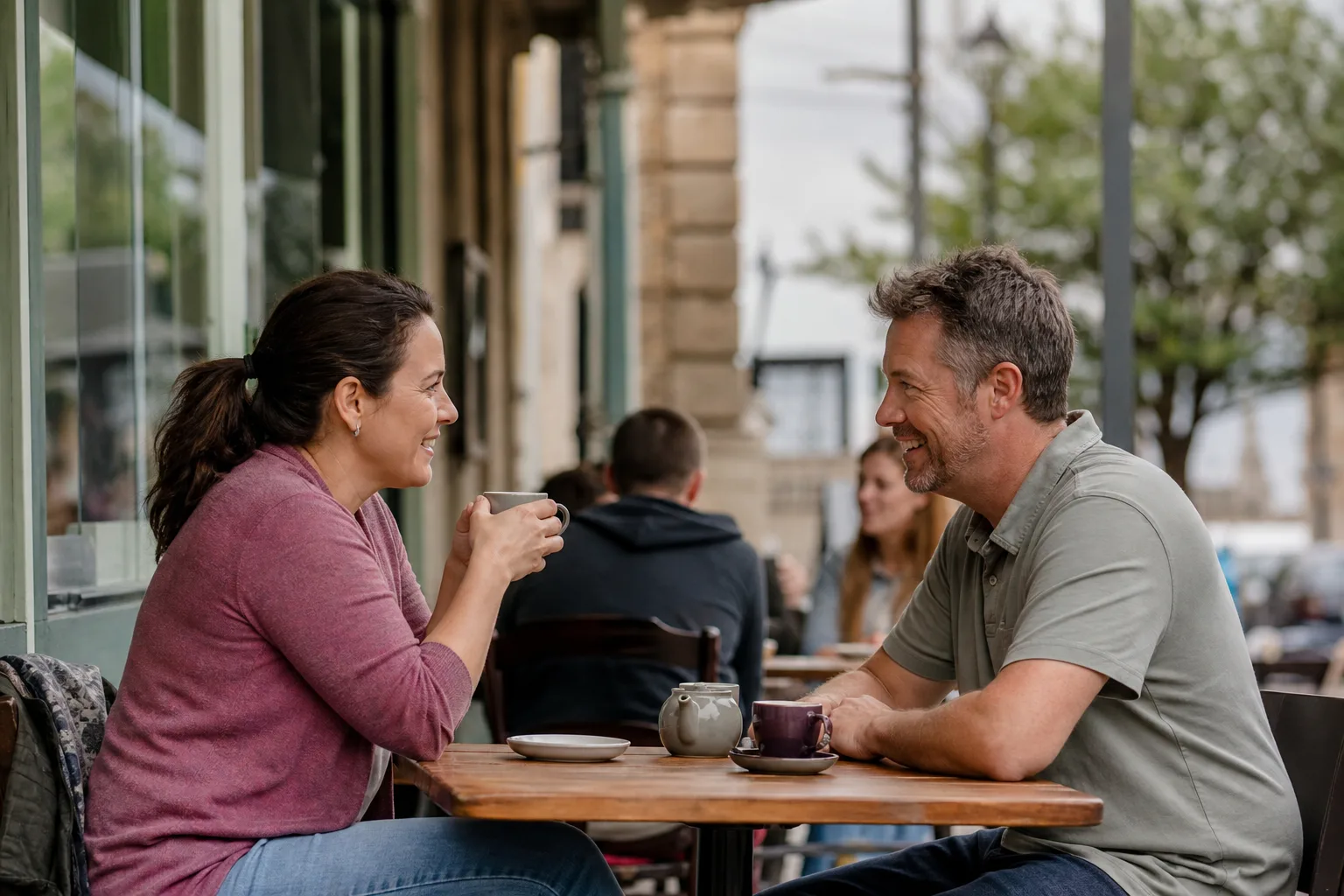 Two people talking beside the river in Huntingdonshire