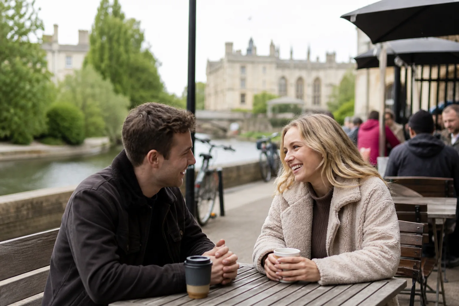 Couple walking beside the River Cam in Cambridge